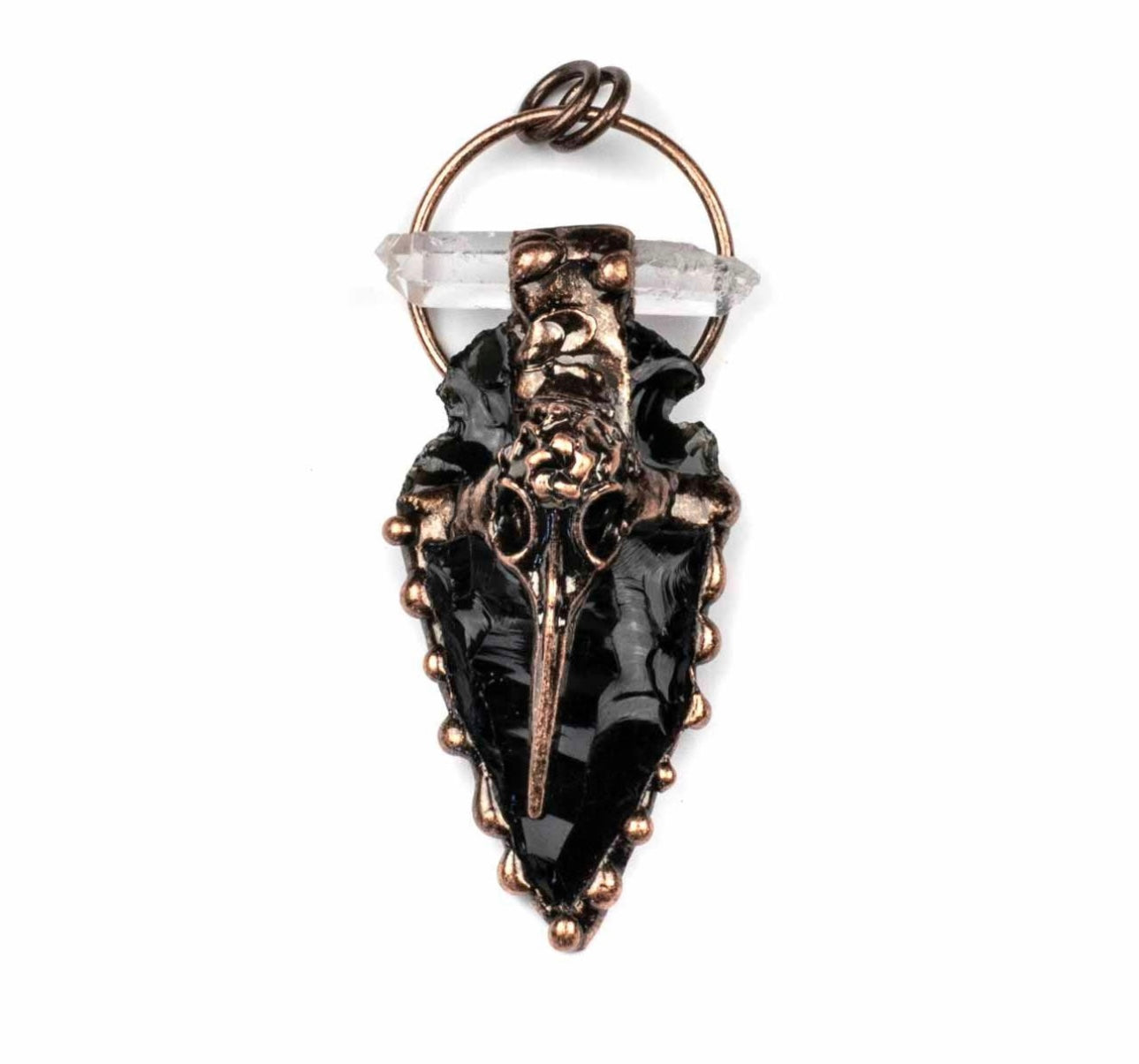 Black agate arrowhead with bird skull